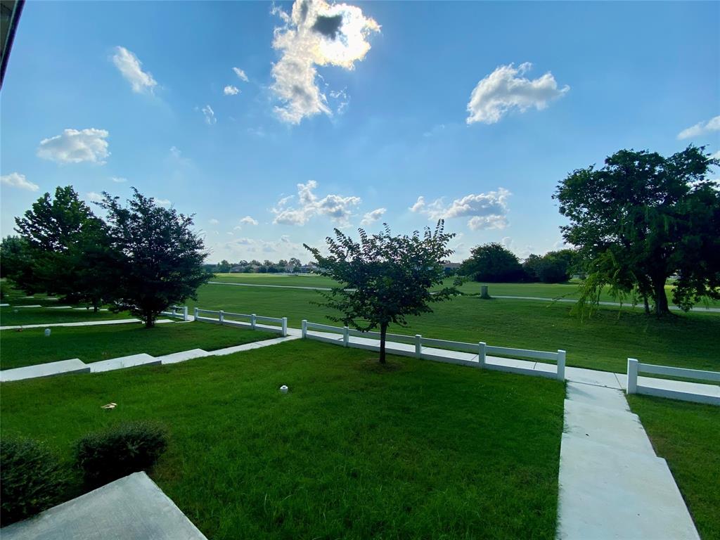 196 Martha Lane Kyle, TX 78640 - Photo 29 of 30 a view of a golf course with a lake