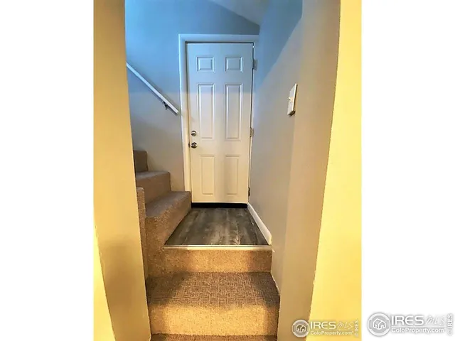 a kitchen with granite countertop a stove and a refrigerator