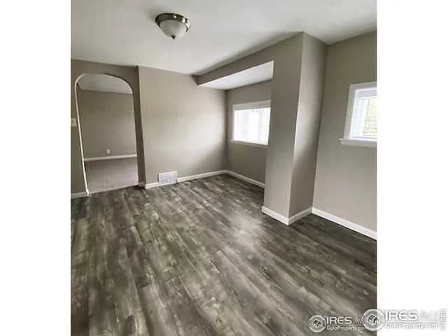 a view of an empty room and window