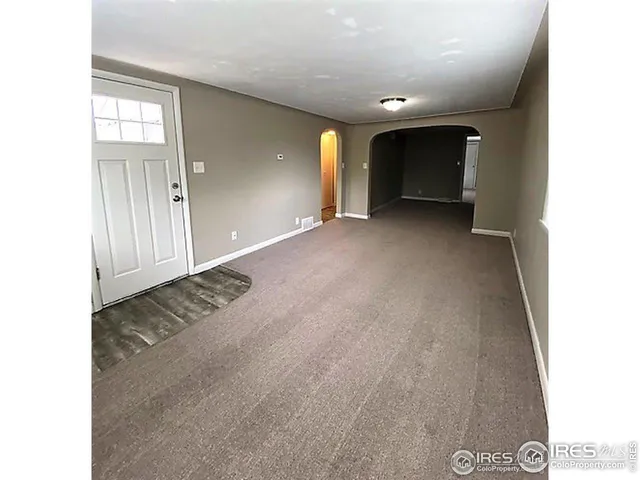 a view of a livingroom with a staircase