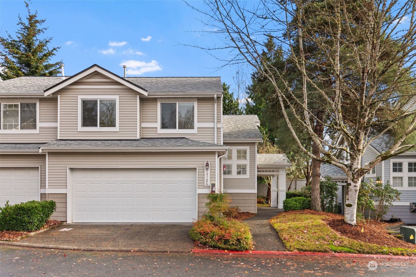 19126 110th Place Southeast Renton, WA 98055 - Photo 1 of 40 a front view of a house with a yard and garage