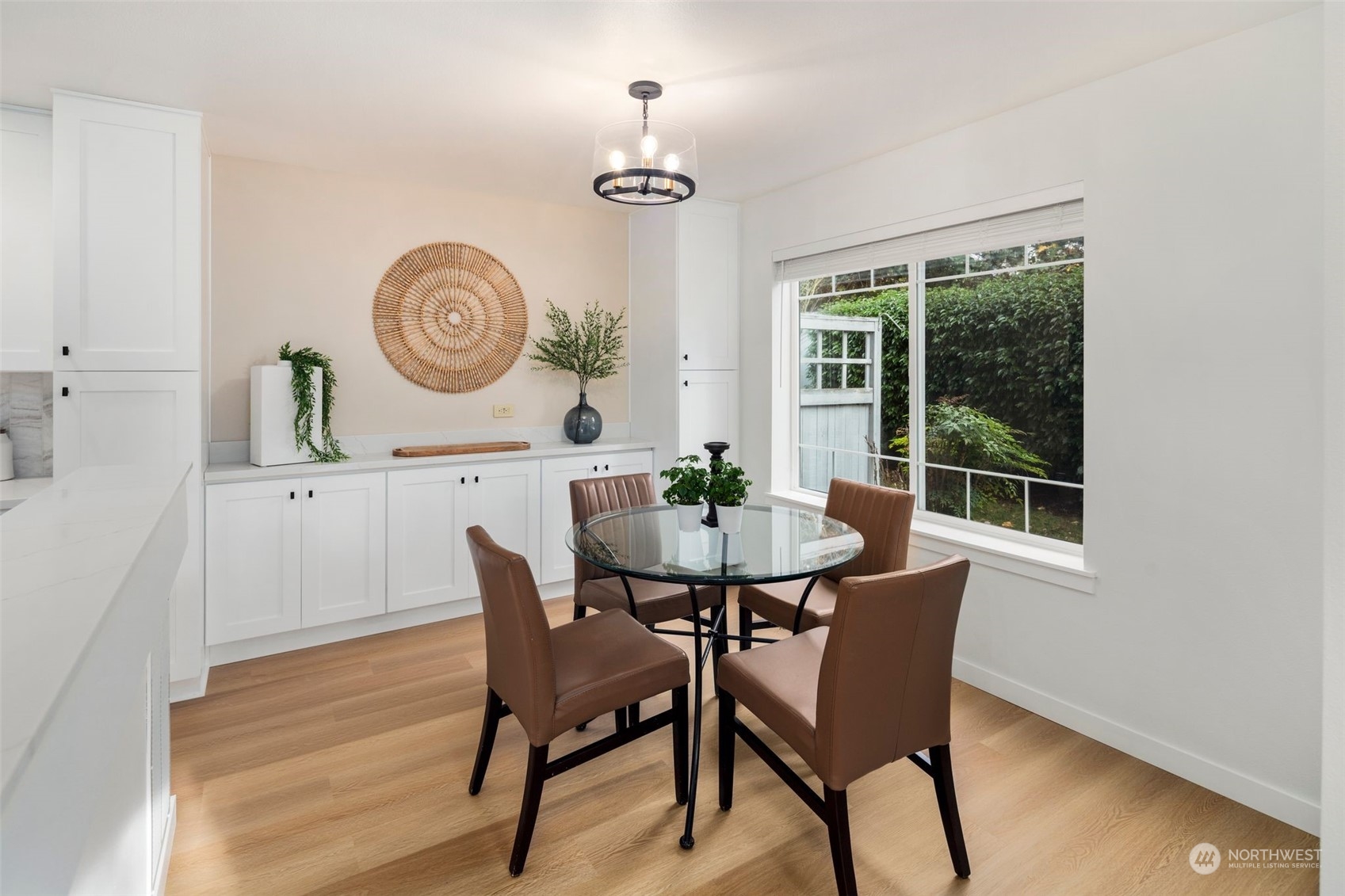 19126 110th Place Southeast Renton, WA 98055 - Photo 17 of 40 a view of a dining room with furniture window and wooden floor
