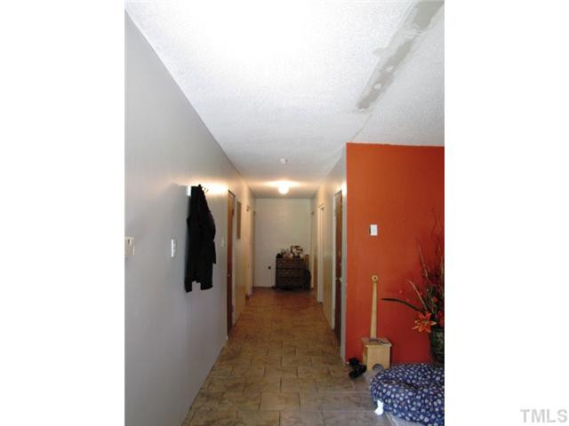 6009 Cheek Road Durham, NC 27704 - Photo 3 of 12 a view of a hallway with interior