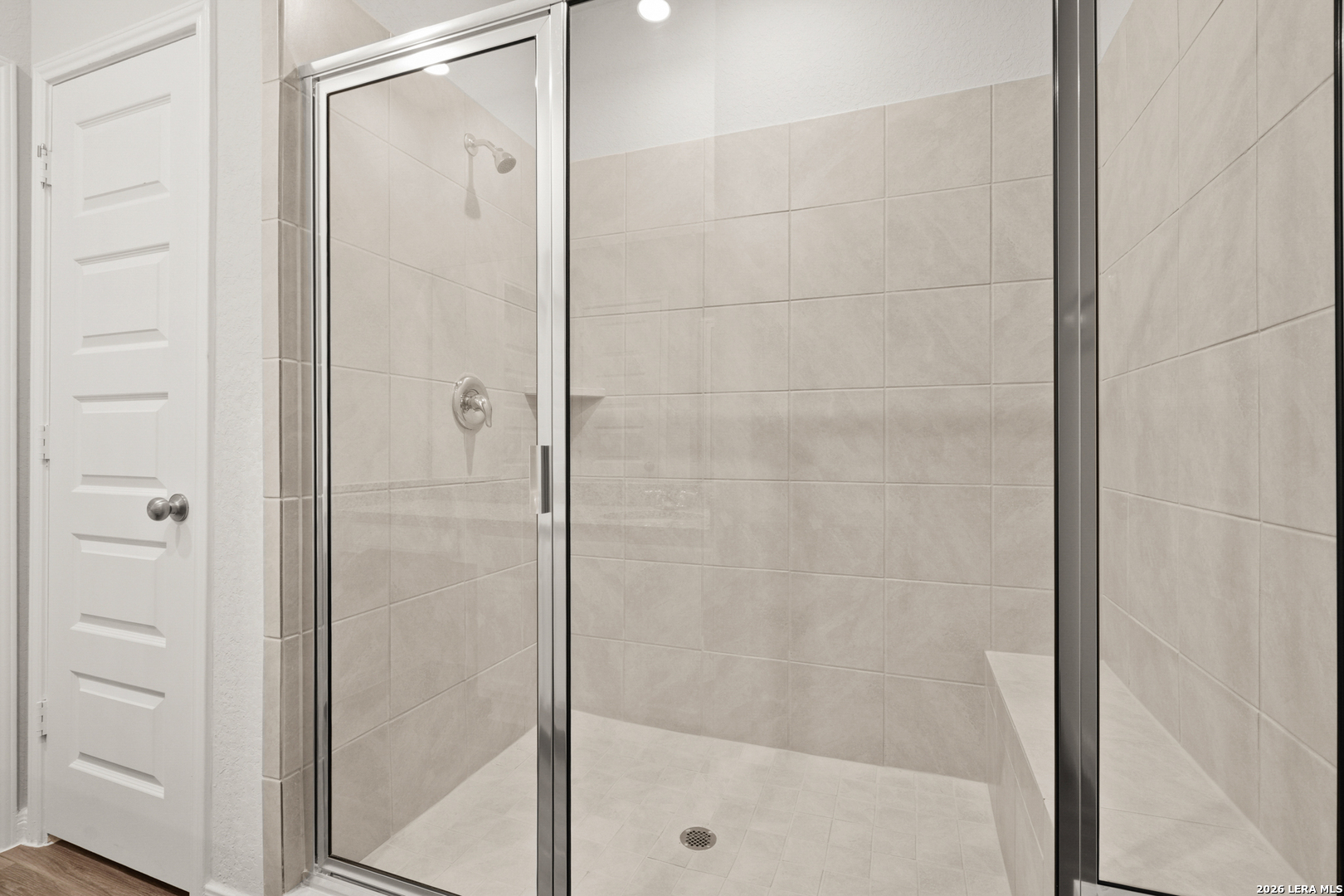 13631 Helton Pass St. Hedwig, TX 78152 - Photo 14 of 33 a bathroom with a glass shower door