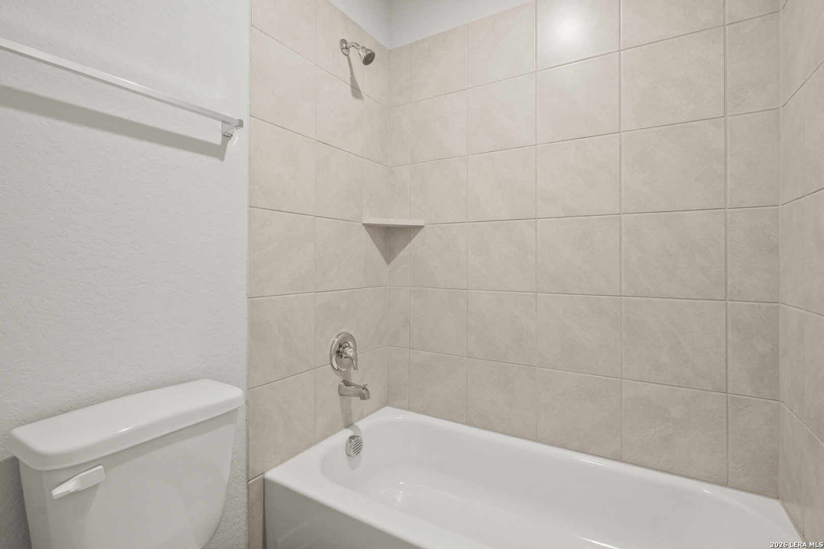 13631 Helton Pass St. Hedwig, TX 78152 - Photo 23 of 33 a bath tub sitting next to a white toilet and a shower