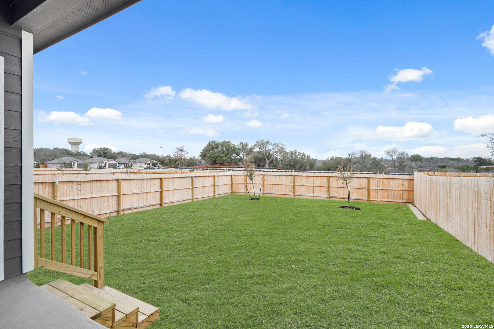 13631 Helton Pass St. Hedwig, TX 78152 - Photo 24 of 33 a view of a green field with wooden fence