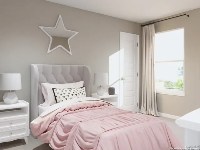 a bedroom with a bed and a dresser