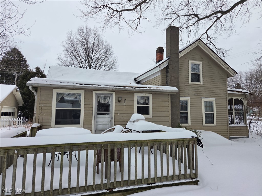 4473 Middle Ridge Road Perry, OH 44081 - Photo 7 of 22 Snow covered house with a chimney
