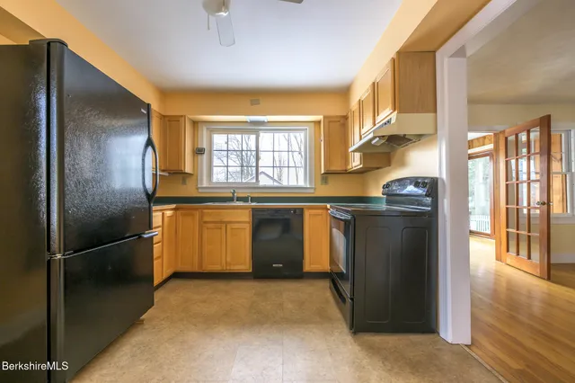 a view of a house with a flower garden