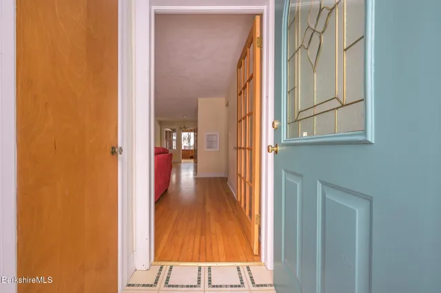 a kitchen with stainless steel appliances a stove a microwave and a window