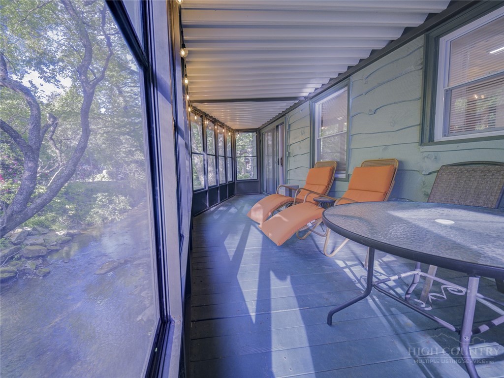 1471 Bamboo Road Boone, NC 28607 - Photo 14 of 19 a backyard of a house with table and chairs