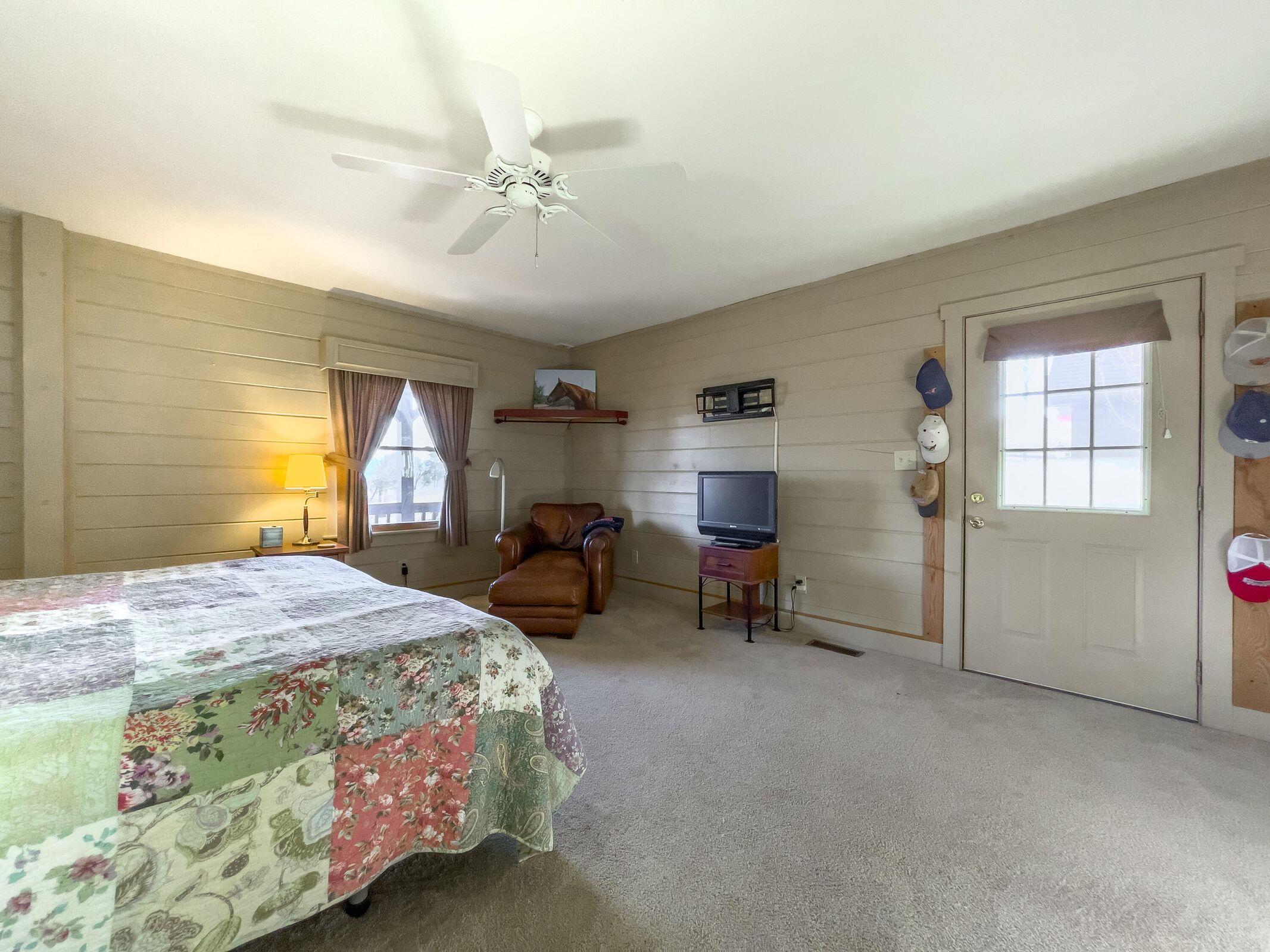 80 Good View Drive Raphine, VA 24472 - Photo 29 of 59 a bedroom with a bed and a chandelier