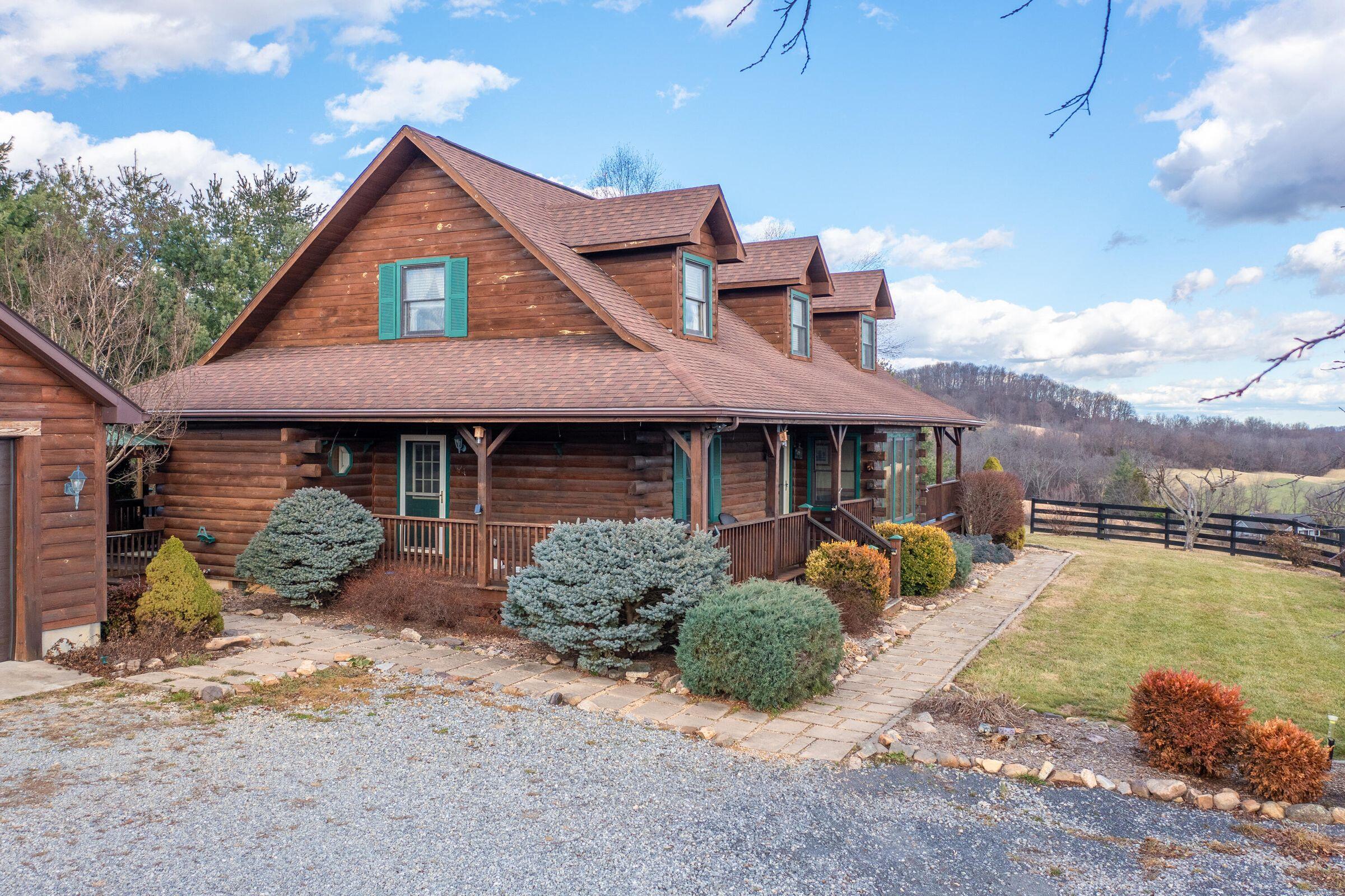80 Good View Drive Raphine, VA 24472 - Photo 5 of 59 a front view of a house with a yard and seating space