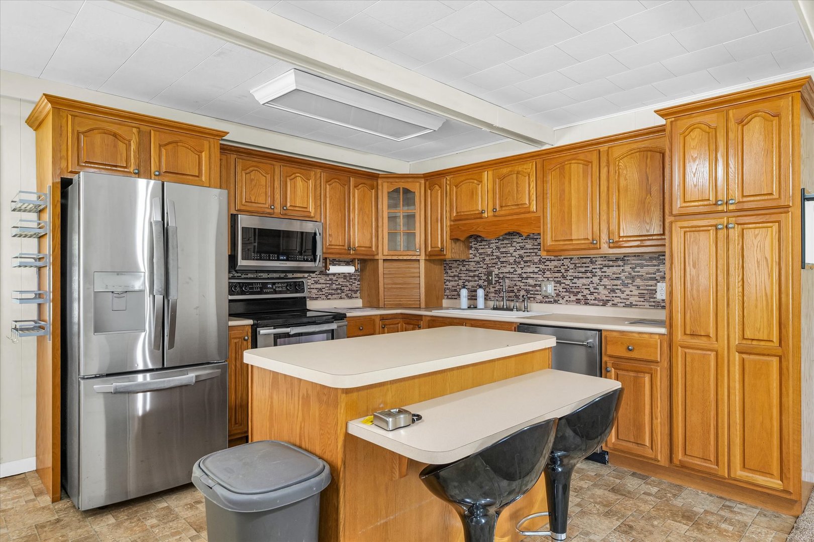 101 Delmar Catlin, IL 61817 - Photo 12 of 32 a kitchen with stainless steel appliances a refrigerator and stove