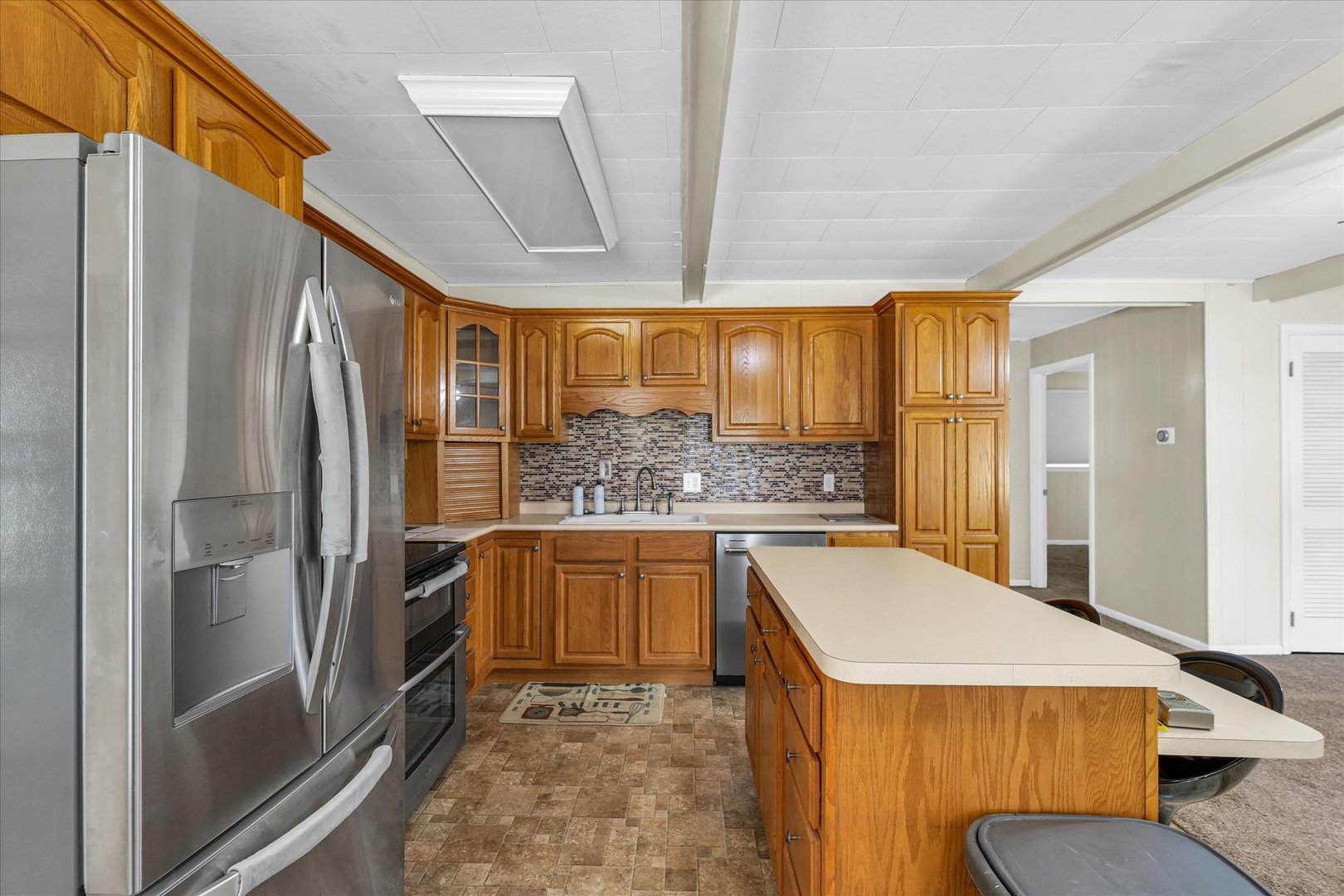 101 Delmar Catlin, IL 61817 - Photo 13 of 32 a kitchen with stainless steel appliances granite countertop a refrigerator and a stove