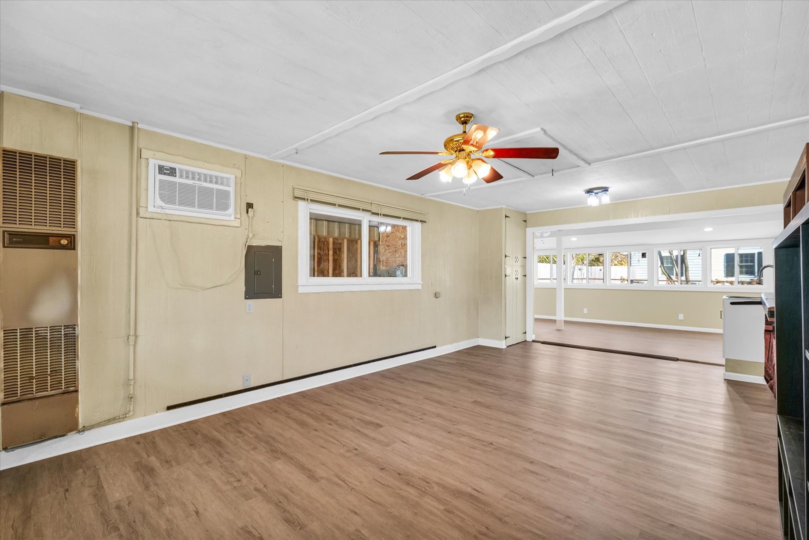 101 Delmar Catlin, IL 61817 - Photo 16 of 32 a view of an empty room with a window and wooden floor