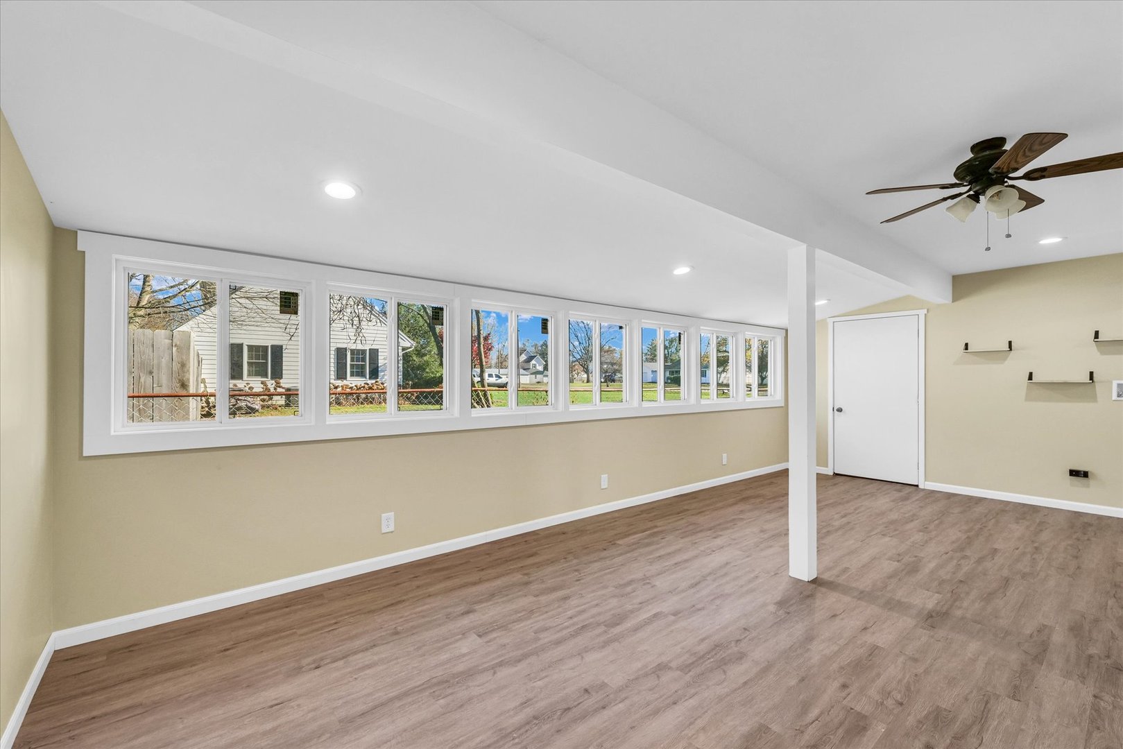 101 Delmar Catlin, IL 61817 - Photo 20 of 32 a view of an empty room with a window and wooden floor