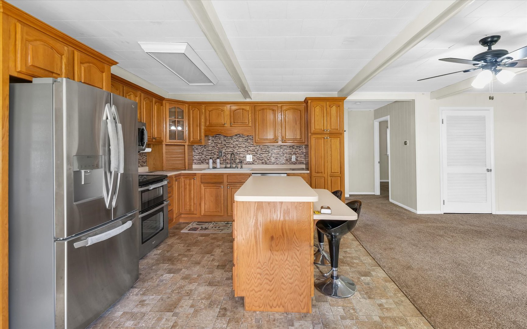 101 Delmar Catlin, IL 61817 - Photo 6 of 32 a kitchen with stainless steel appliances granite countertop a refrigerator and a stove top oven