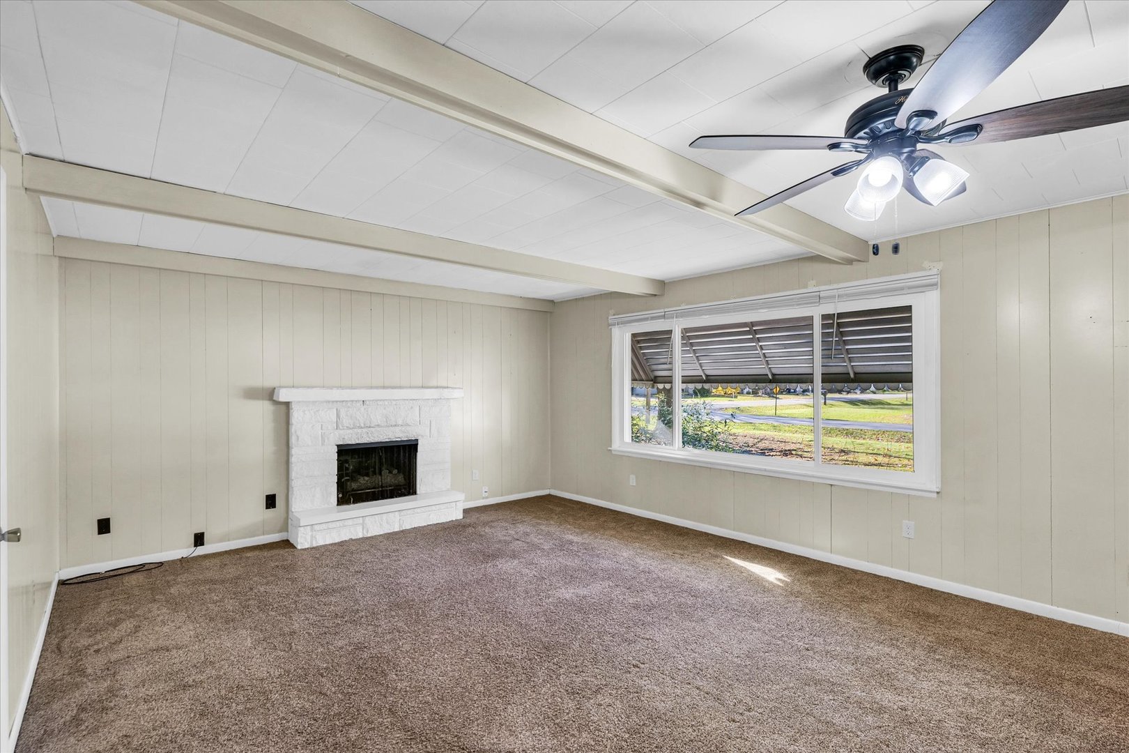 101 Delmar Catlin, IL 61817 - Photo 8 of 32 a view of an empty room with a fireplace and a window