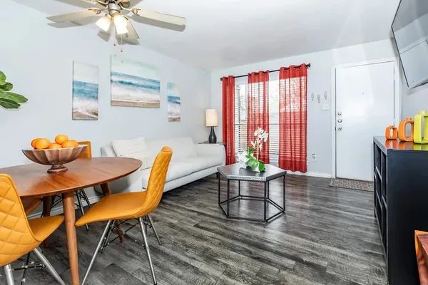 a view of a dining room with furniture window and wooden floor