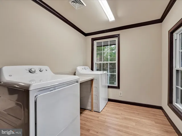 a view of an empty room with a large window