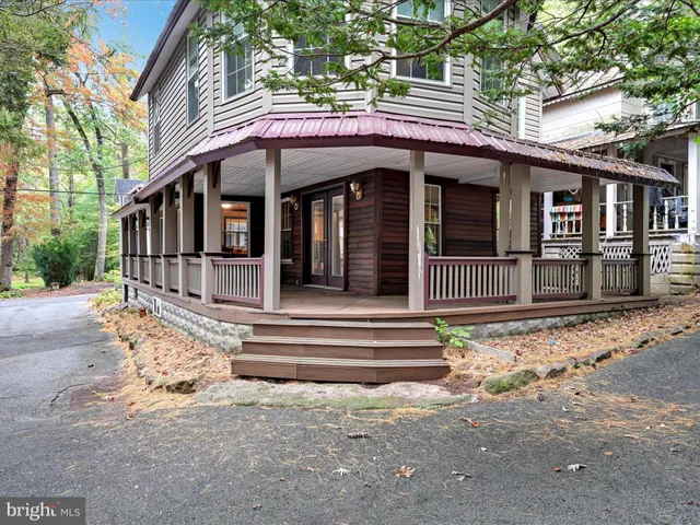 a front view of a house with a small garden