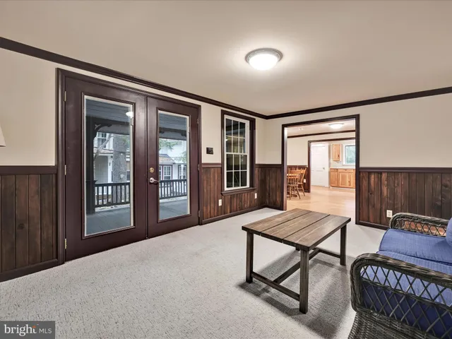 a bedroom with furniture and wooden floor