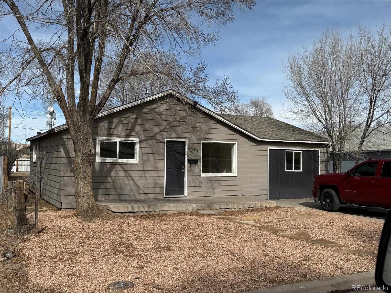 623 9th Street Alamosa, CO 81101 - Photo 1 of 10 a front view of a house with yard