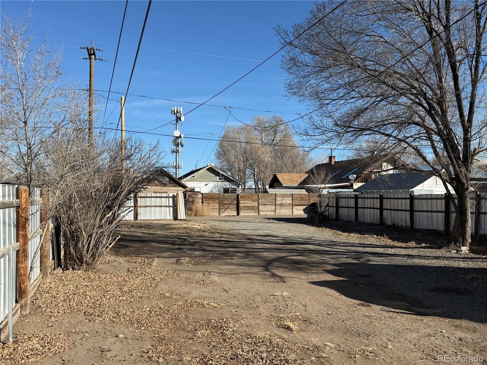 623 9th Street Alamosa, CO 81101 - Photo 2 of 10 a front view of a house with a yard and garage