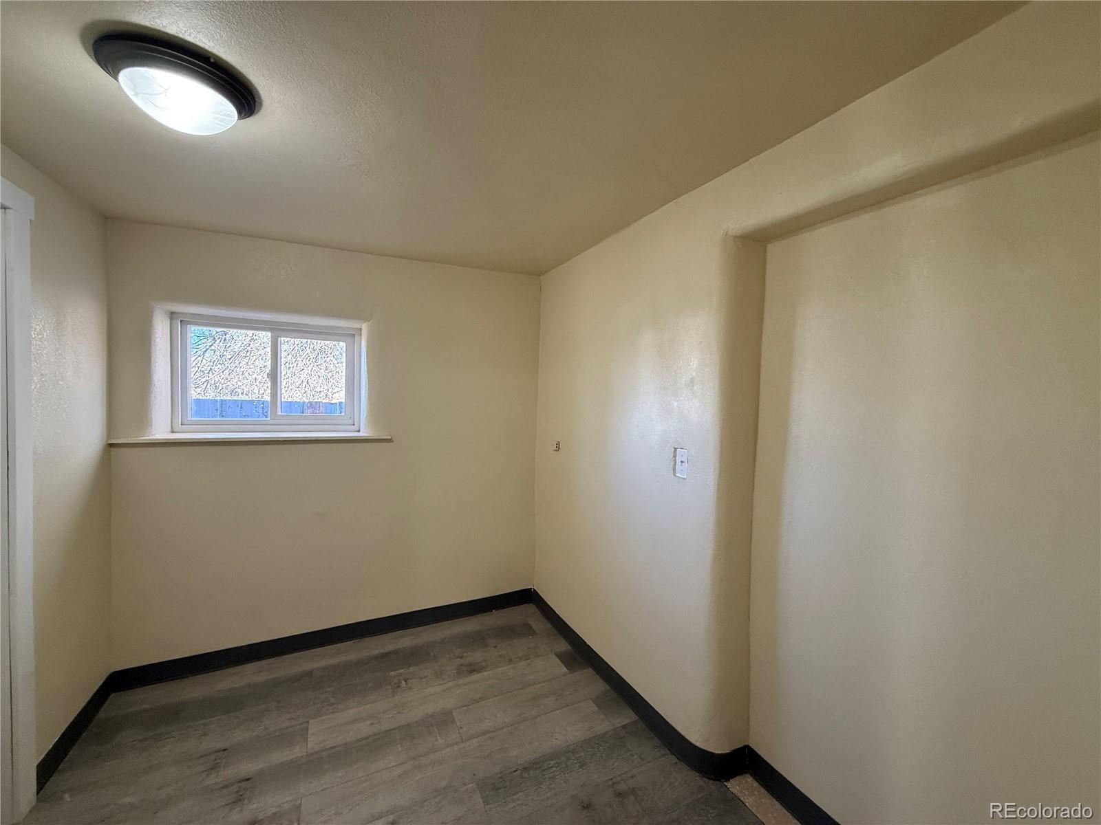 623 9th Street Alamosa, CO 81101 - Photo 4 of 10 an empty room with a window