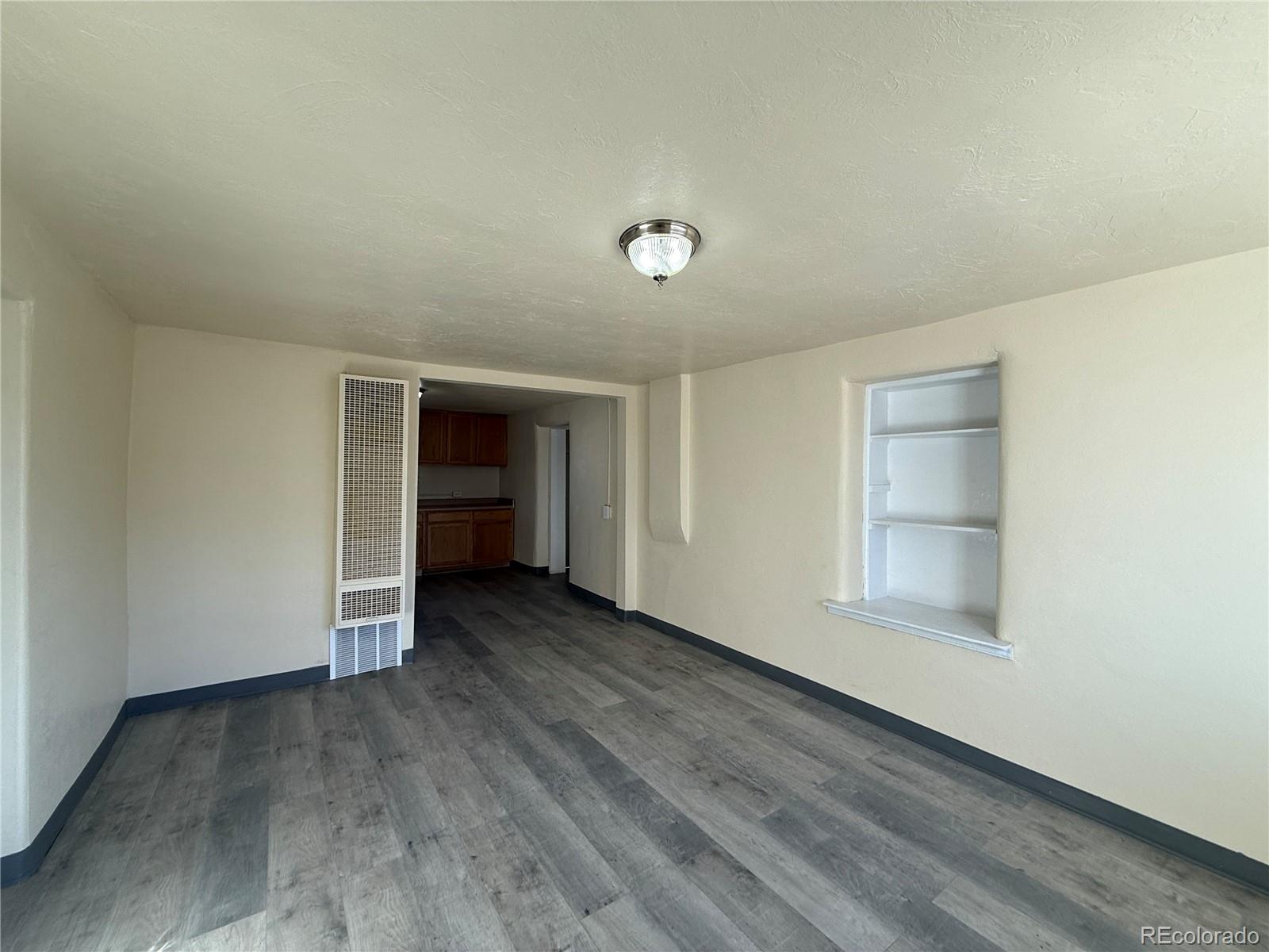 623 9th Street Alamosa, CO 81101 - Photo 6 of 10 an empty room with closet and windows