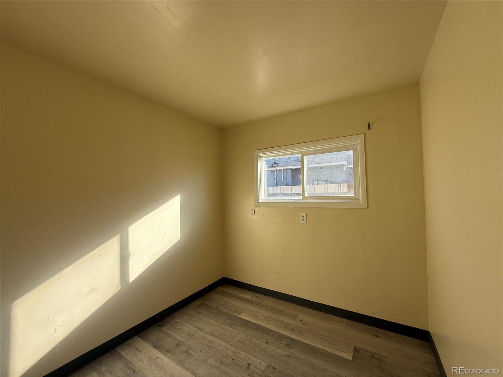 623 9th Street Alamosa, CO 81101 - Photo 9 of 10 a view of an empty room and window