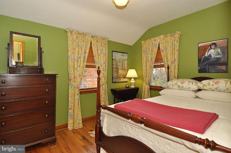 10003 Raynor Road Silver Spring, MD 20901 - Photo 18 of 28 a bedroom with a bed and wooden floor