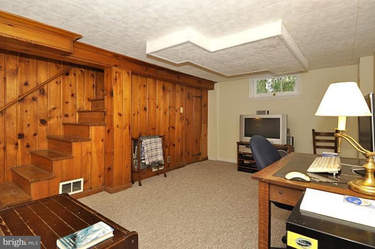 10003 Raynor Road Silver Spring, MD 20901 - Photo 23 of 28 a bedroom with a bed and a tv