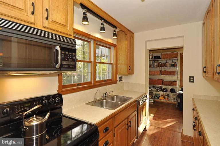 10003 Raynor Road Silver Spring, MD 20901 - Photo 9 of 28 a kitchen that has a sink and a stove