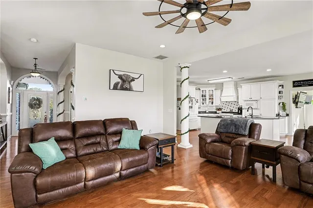 a view of a dining room with furniture and wooden floor