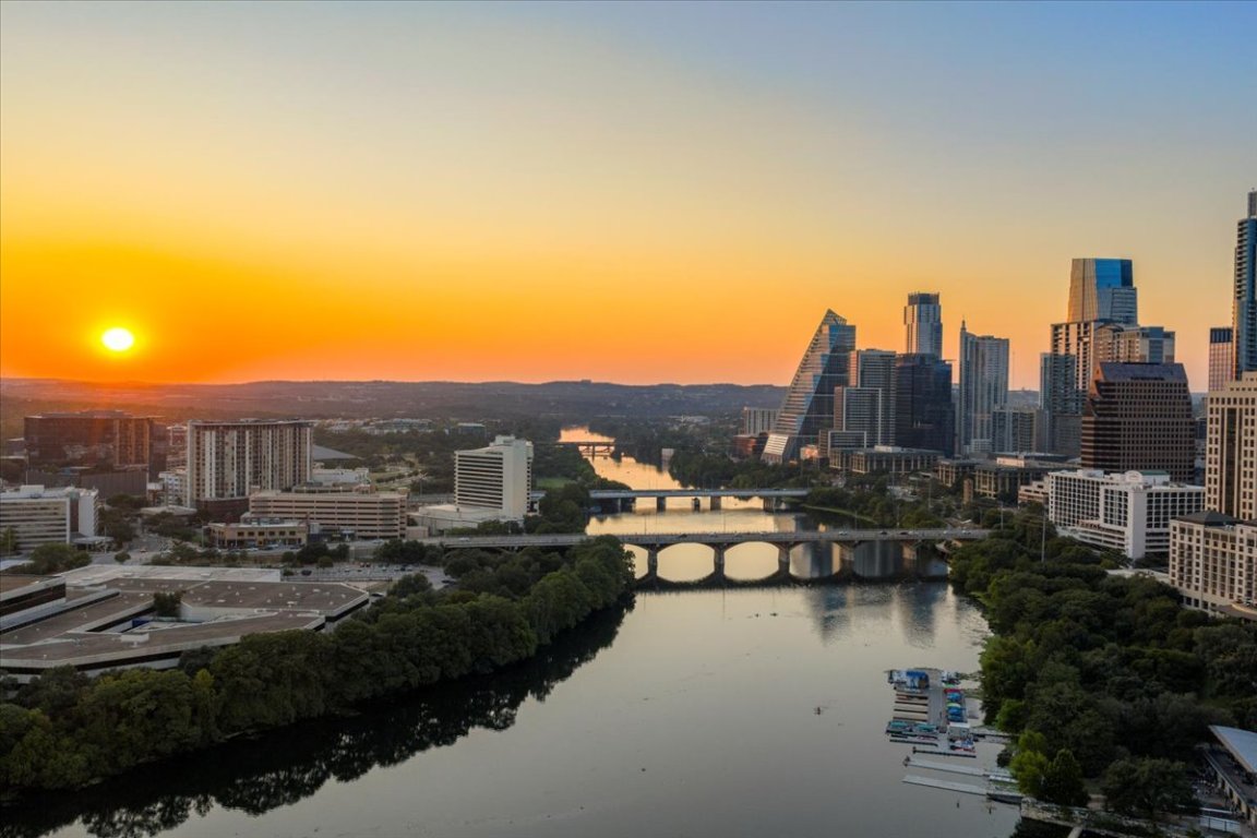 70 Rainey Street, Unit 1503 Austin, TX 78701 - Photo 23 of 30 Skyline view featuring a large body of water and a notable bridge