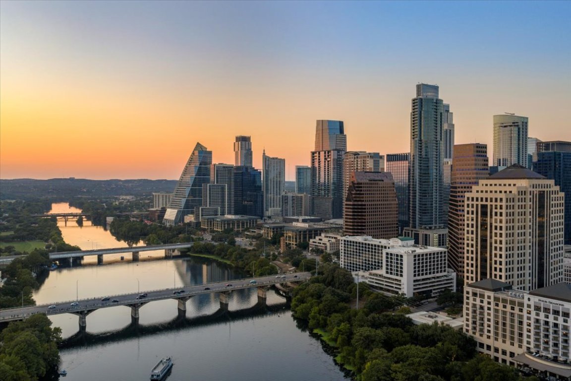 70 Rainey Street, Unit 1503 Austin, TX 78701 - Photo 27 of 30 Skyline view with a large body of water and a notable bridge