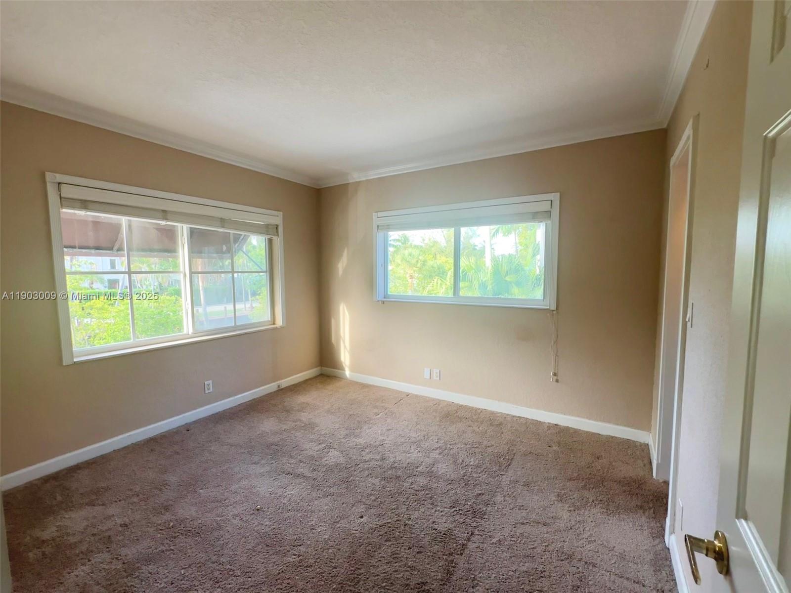 924 Southeast 2nd Street, Unit 9 Fort Lauderdale, FL 33301 - Photo 11 of 19 an empty room with windows