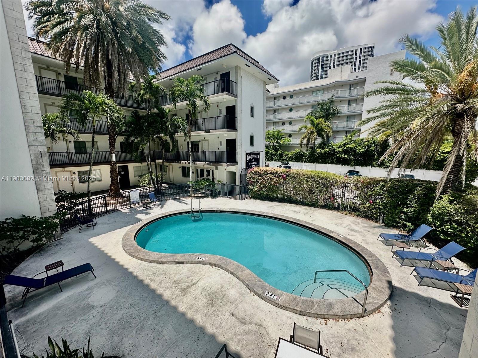 924 Southeast 2nd Street, Unit 9 Fort Lauderdale, FL 33301 - Photo 13 of 19 a swimming pool with outdoor seating and yard