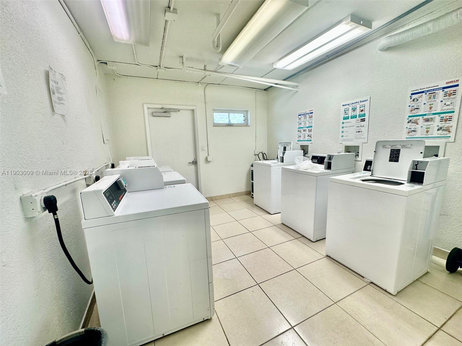 924 Southeast 2nd Street, Unit 9 Fort Lauderdale, FL 33301 - Photo 15 of 19 a room with dryer and washer