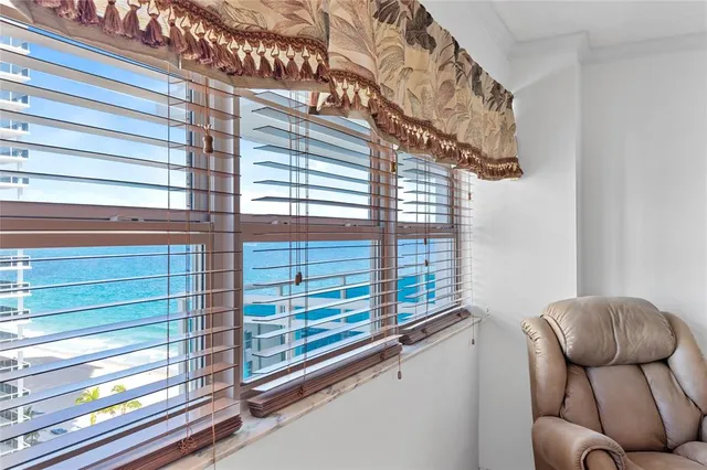 a view of balcony with furniture