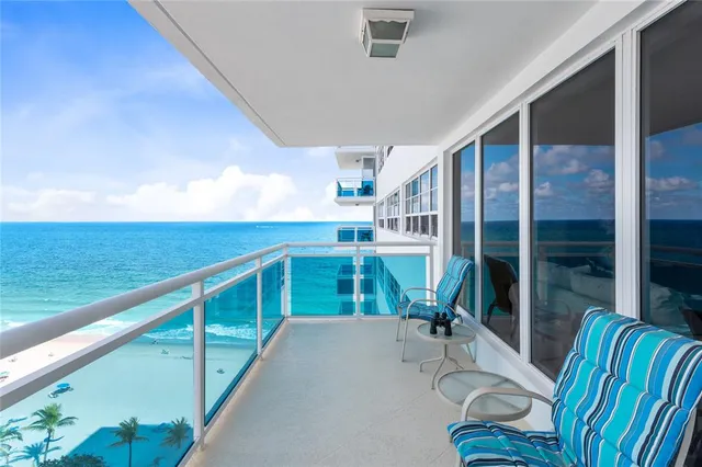 a view of balcony with furniture