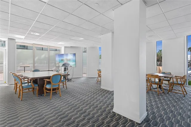 a view of a hallway with wooden cabinets