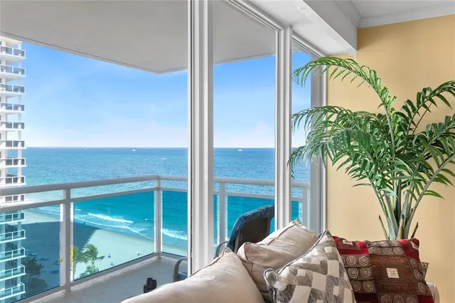 a bedroom with a bed and a potted plant next to a window