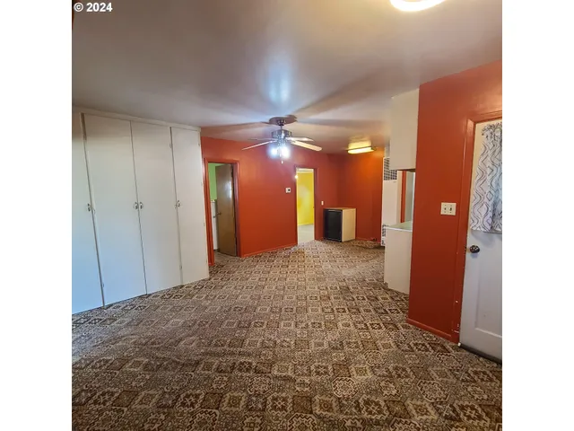 a view of a hallway with a bathroom