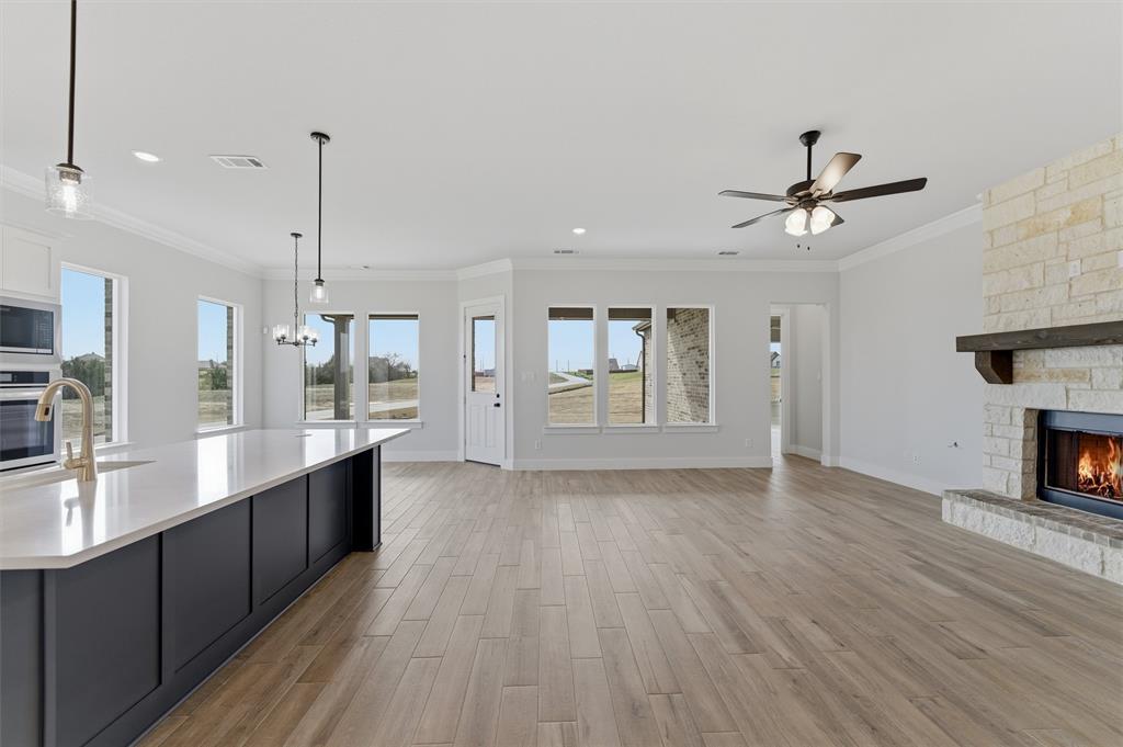 814 Vly Rdg Road Van Alstyne, TX 75495 - Photo 24 of 24 wooden floor in an empty room with a kitchen