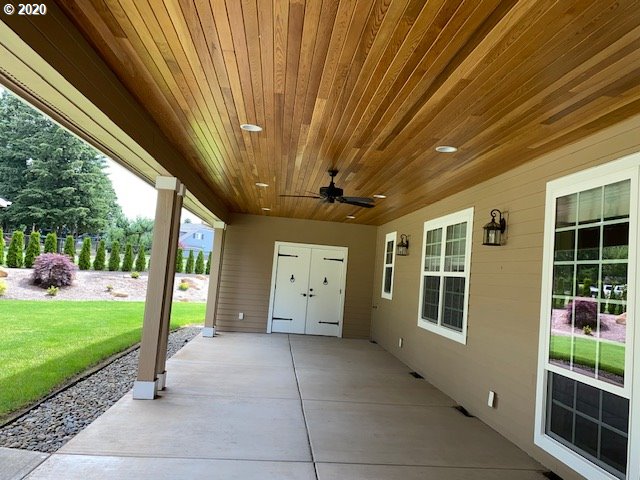 19763 Parrish Road Oregon City, OR 97045 - Photo 22 of 28 a view of a porch with furniture and garden