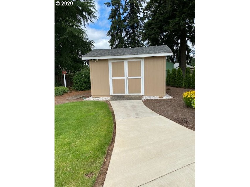 19763 Parrish Road Oregon City, OR 97045 - Photo 27 of 28 a front view of a house with a yard and garage