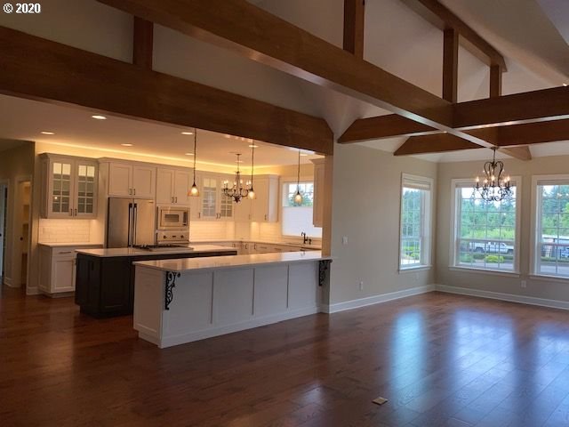 19763 Parrish Road Oregon City, OR 97045 - Photo 4 of 28 a large kitchen with lots of counter space and a sink
